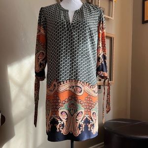 Lovely dress by Forever 21. NWOT. Size M. Shades of blue green gold and orange.